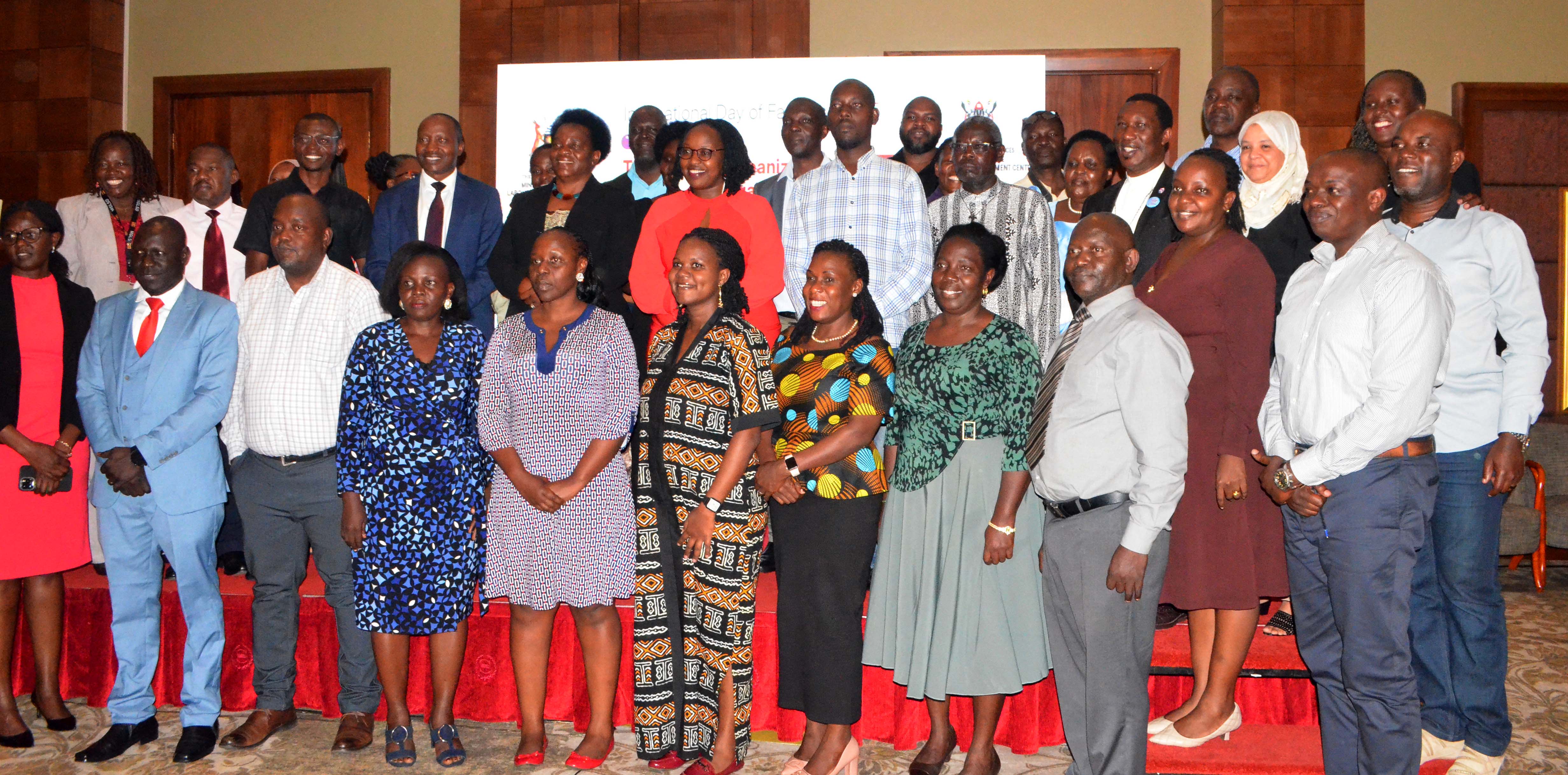 Members of Parenting Agenda take a photo moment during the celebration of International Day of Families at Sheraton Hotel in Kampala